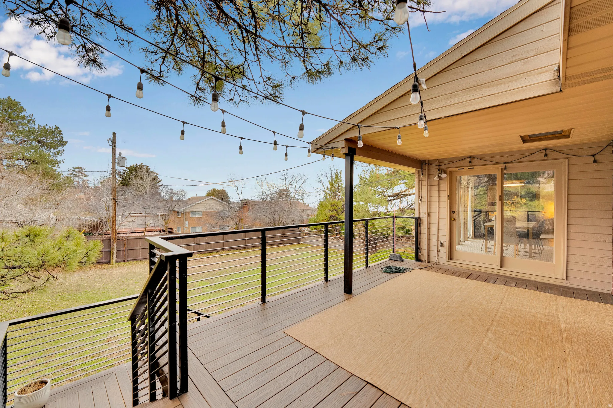 Wooden deck featuring a residential view