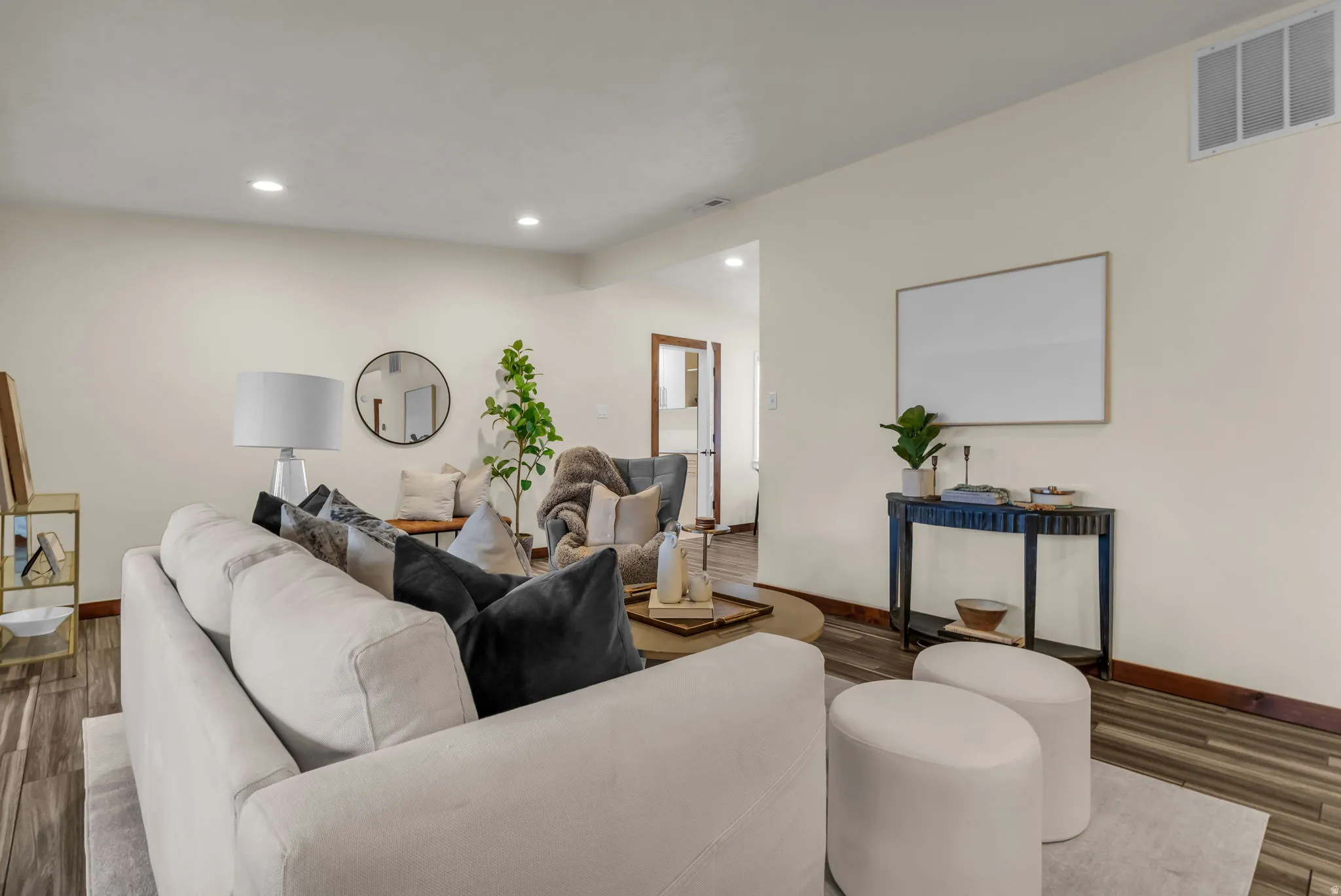 Living area featuring wood finished floors and recessed lighting