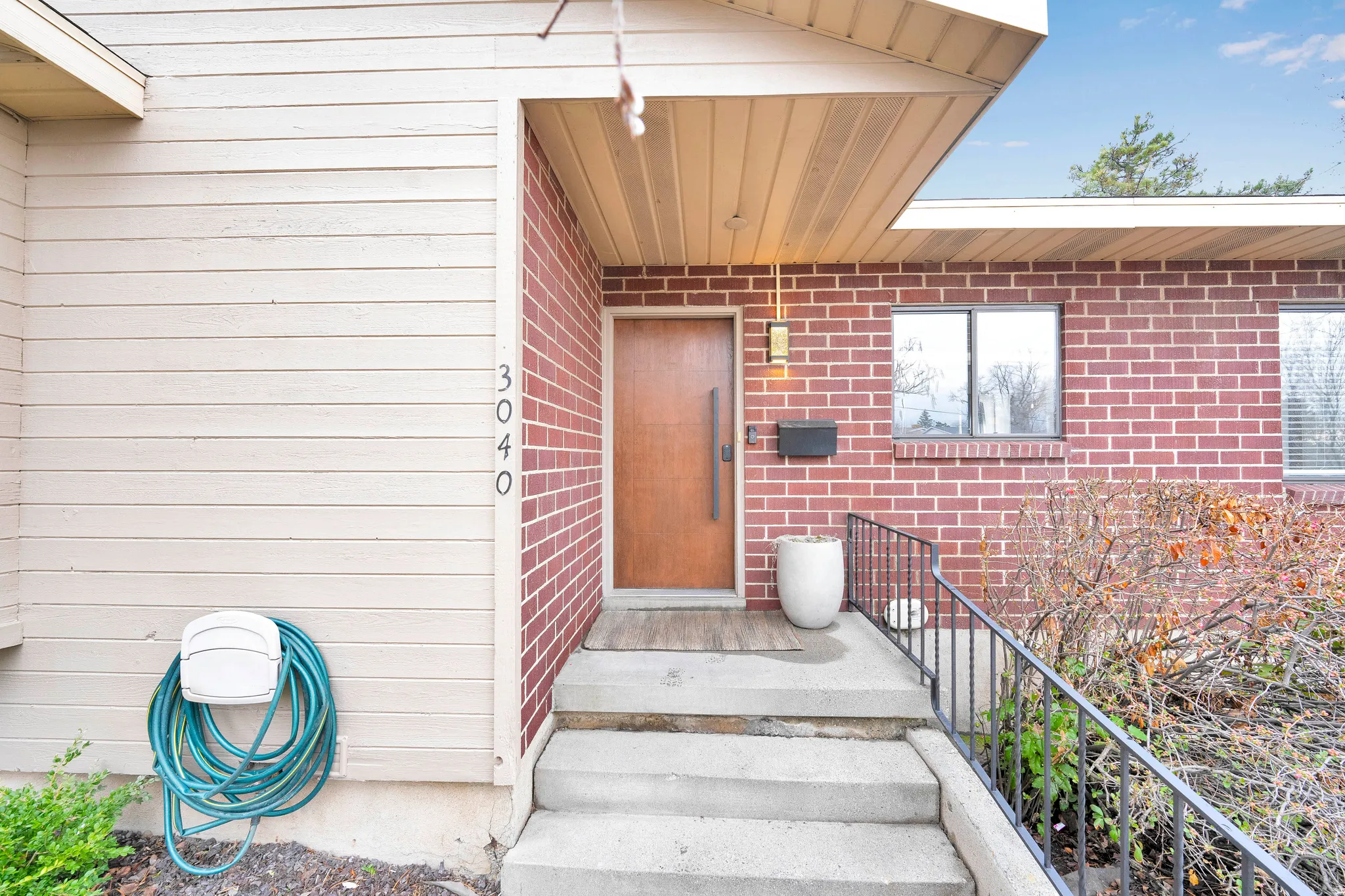 Entrance to property with brick siding