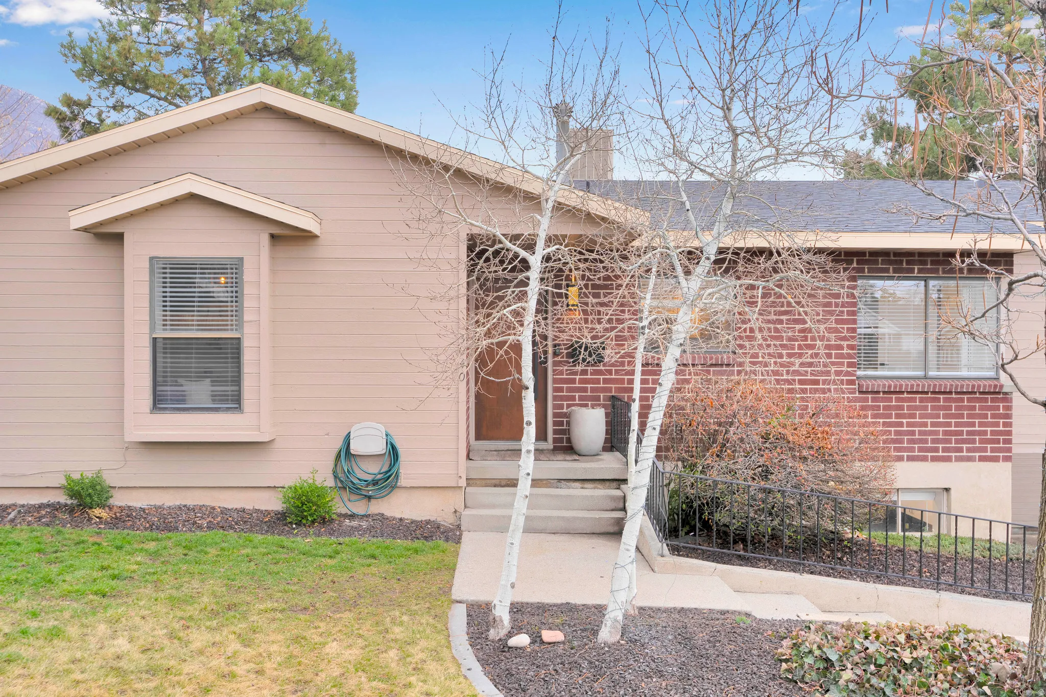 View of front facade featuring brick siding