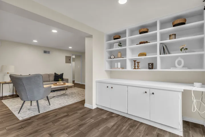Sitting room featuring recessed lighting, dark wood-style floors, a desk, and electric panel