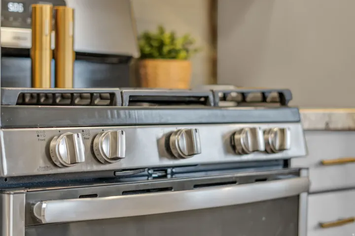 Kitchen view of stainless steel gas stove
