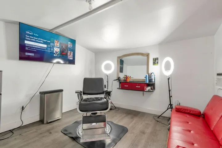 Living area featuring light wood-type flooring and baseboards