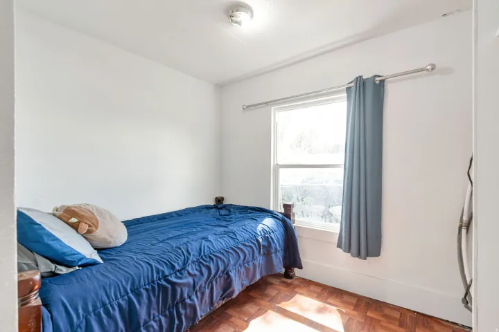 Bedroom with parquet flooring