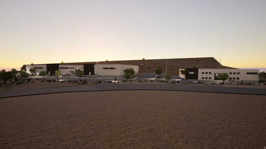 View of front facade featuring a balcony and stucco siding