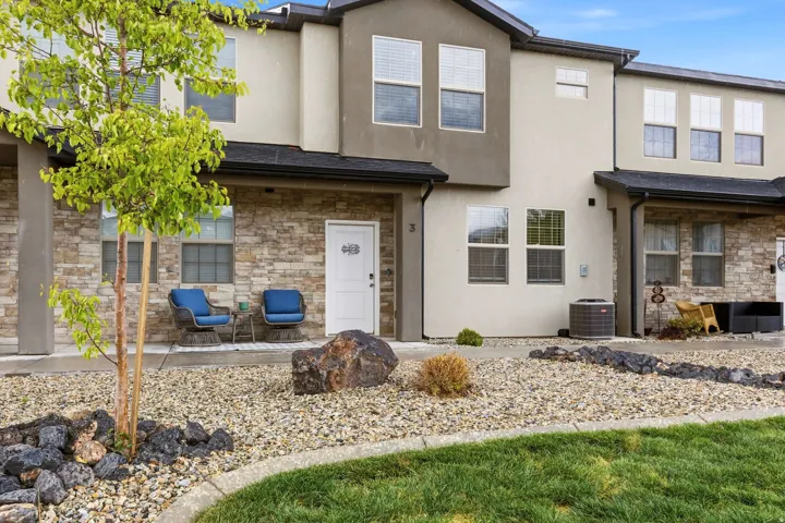 Traditional home featuring stone siding and stucco siding