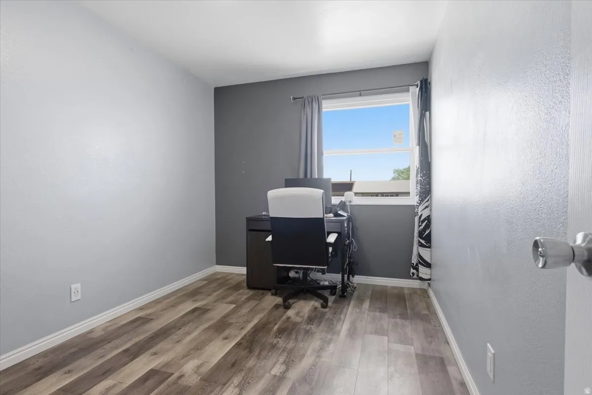 Office space featuring light wood finished floors and baseboards
