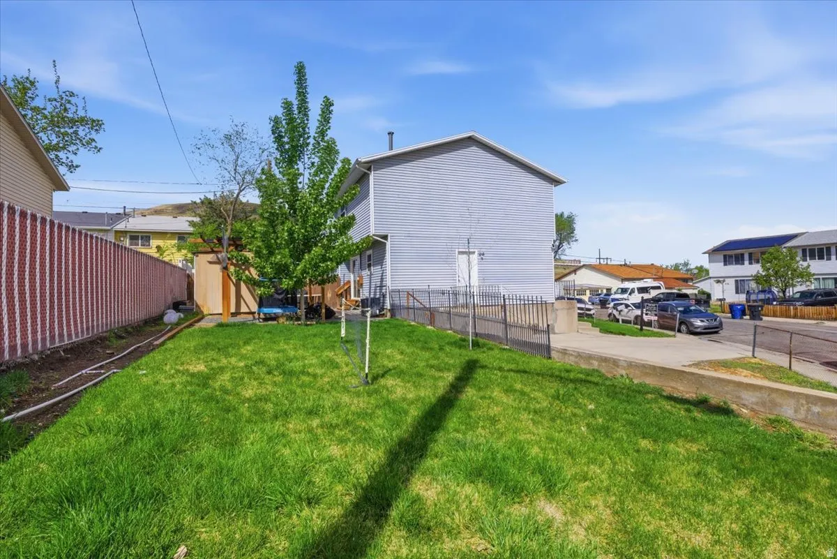 Fenced backyard with a shed