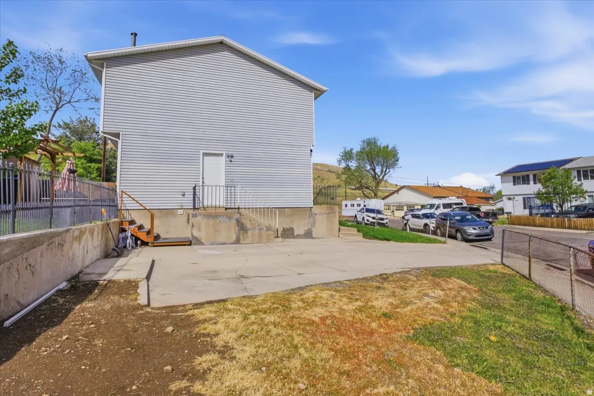View of home's exterior featuring a patio area and a residential view