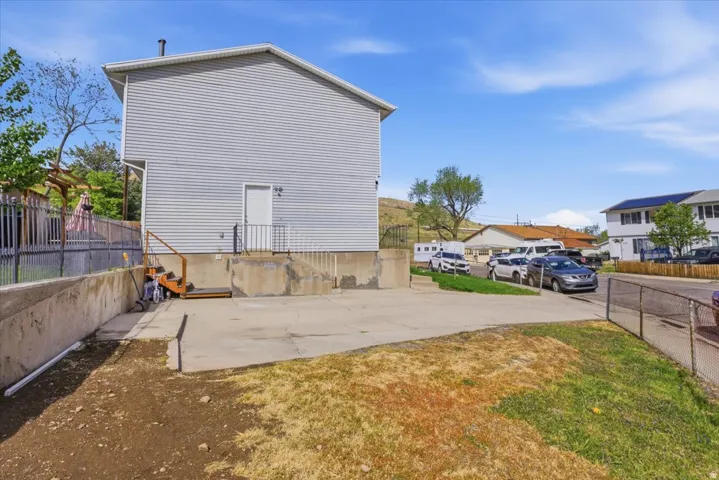 View of home's exterior featuring a patio area and a residential view