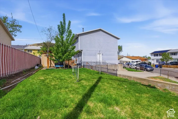 Fenced backyard with a shed