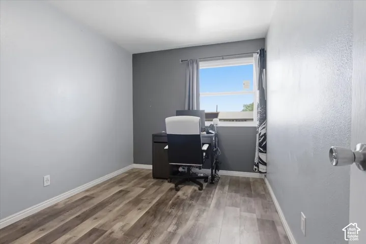Office space featuring light wood finished floors and baseboards