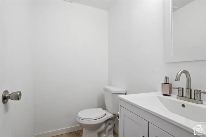 Half bath with vanity and toilet