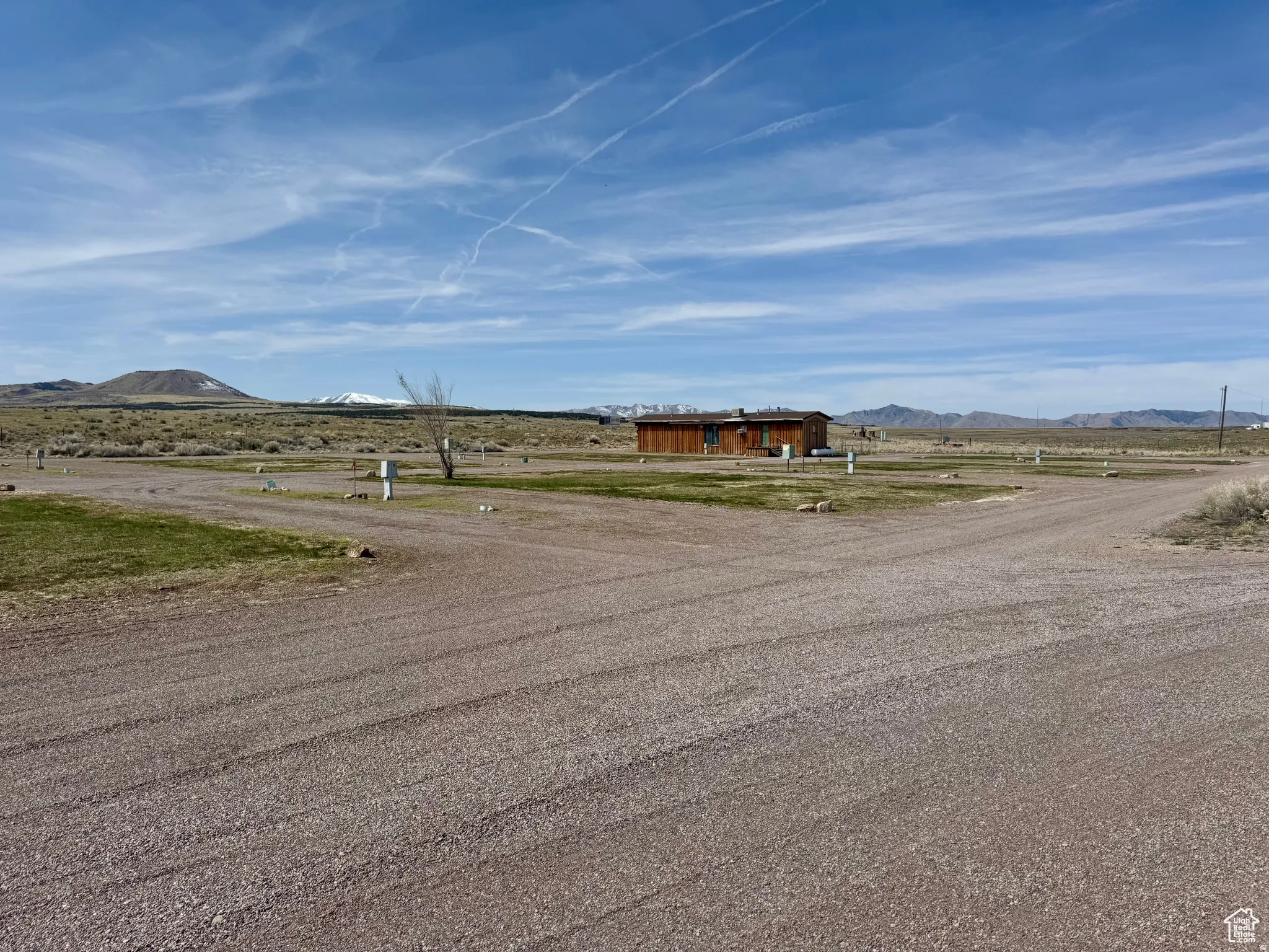 View of street featuring a mountain view and a view of rural / pastoral area