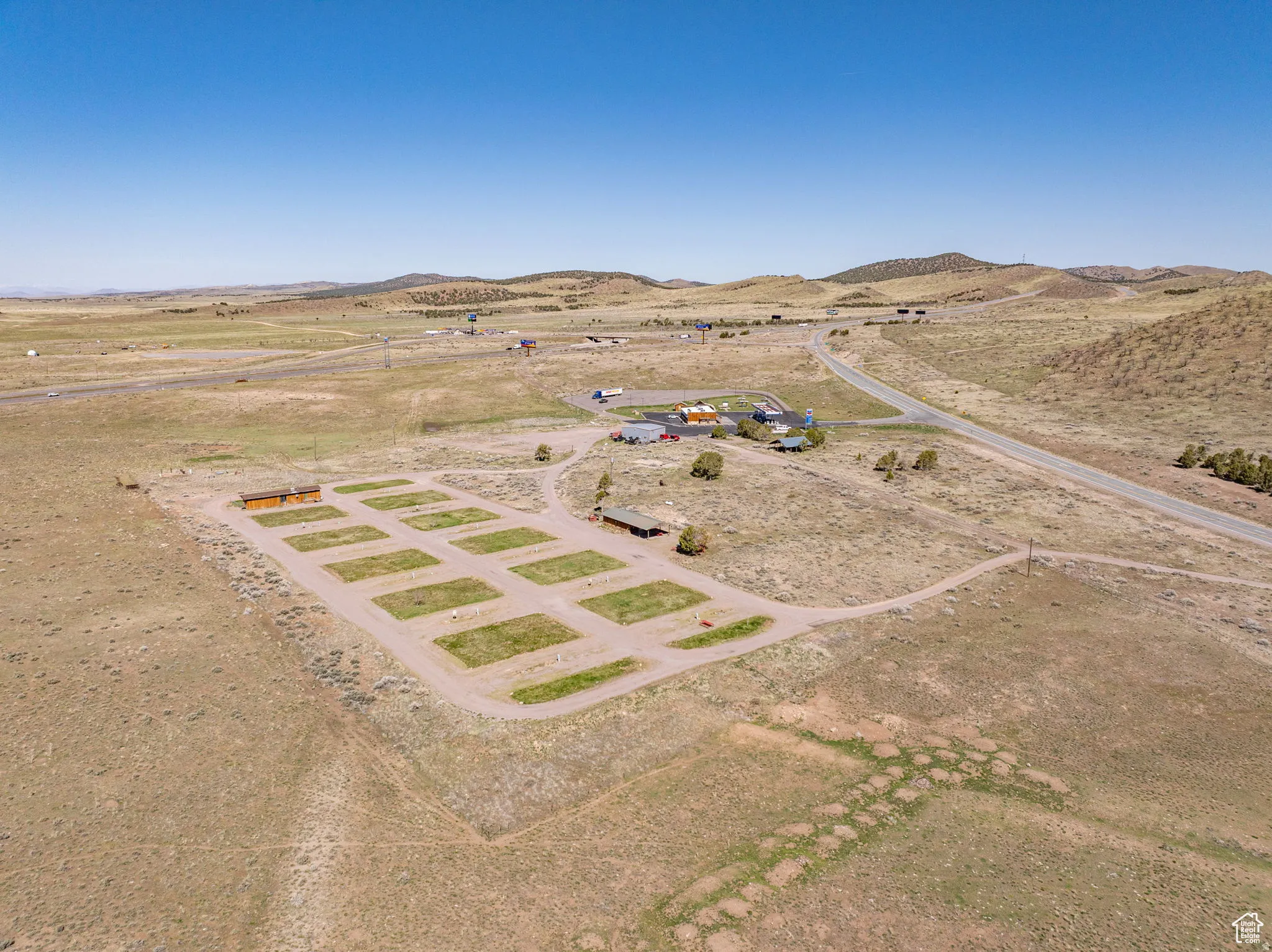 Overview of rural landscape with a desert landscape and a mountain backdrop