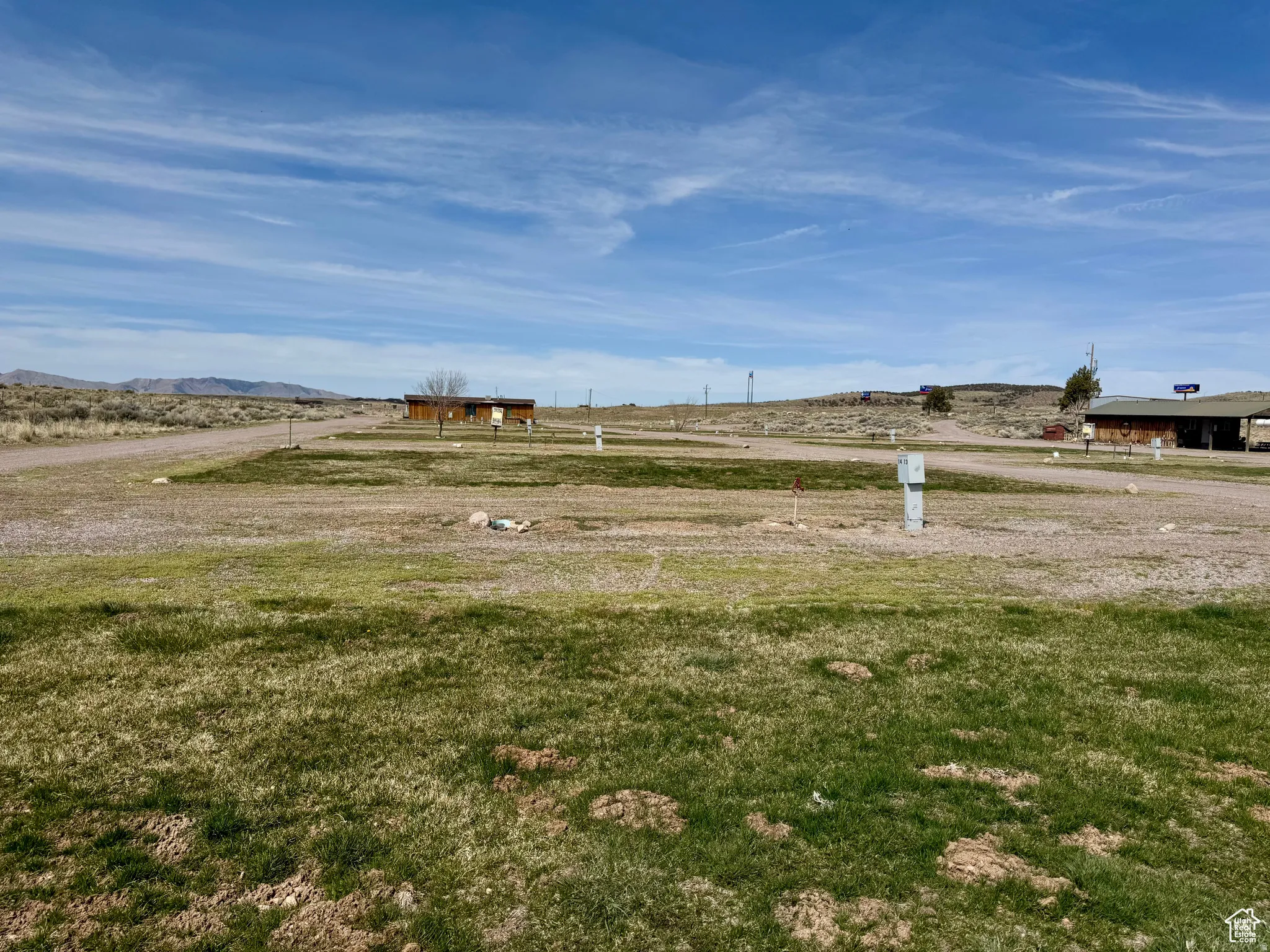 View of grassy yard featuring a view of rural / pastoral area and a mountain view