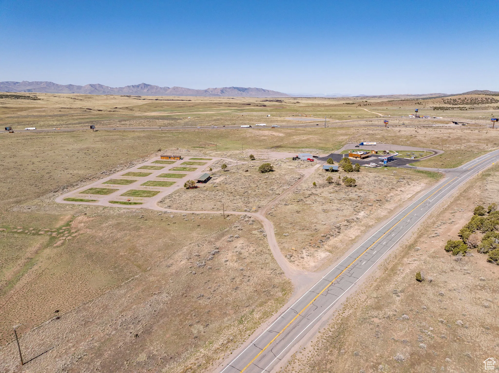 Aerial overview of property's location featuring rural landscape and mountains