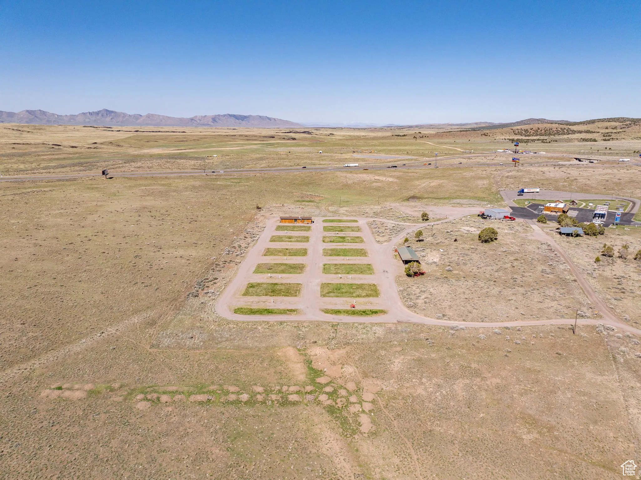 Overview of rural landscape featuring a mountainous background and a desert landscape