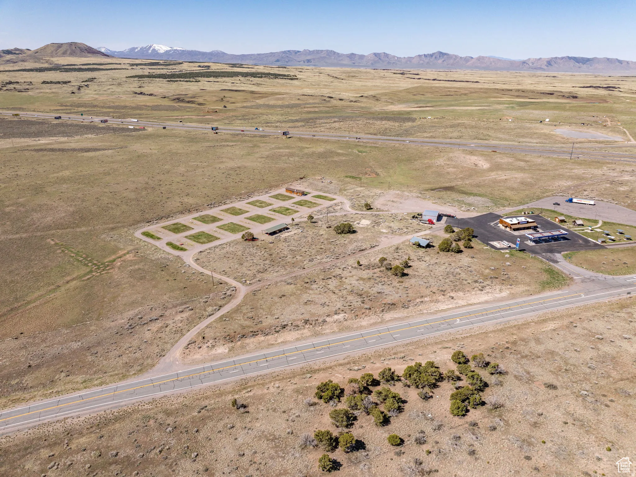 Aerial view of property's location featuring rural landscape and mountains