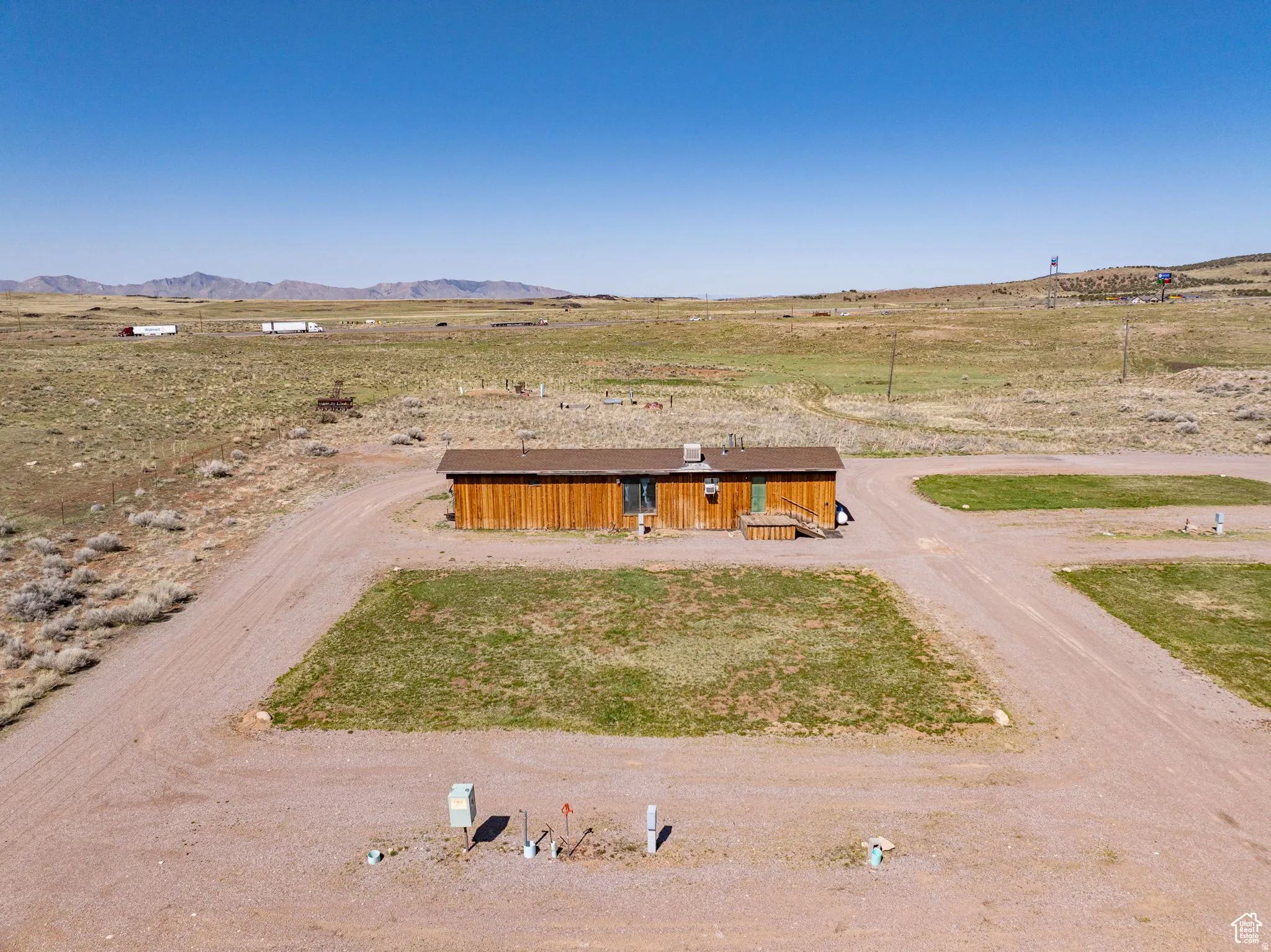 View of front of home with a rural view and a mountain view
