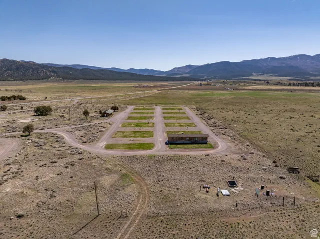 Aerial view of sparsely populated area featuring a mountain backdrop