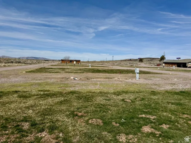 View of grassy yard featuring a view of rural / pastoral area and a mountain view