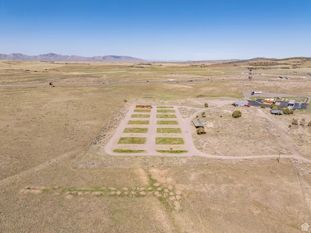 Overview of rural landscape featuring a mountainous background and a desert landscape