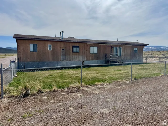 Rear view of property featuring a mountain view