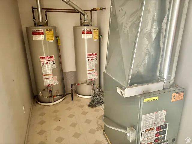 Utility room with water heater and heating unit