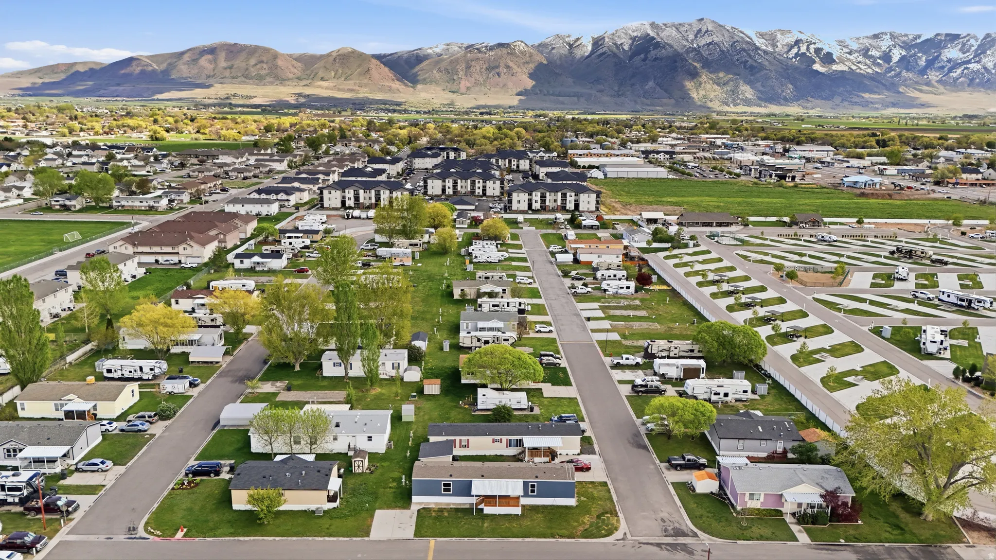 Aerial overview of property's location with nearby suburban area and mountains