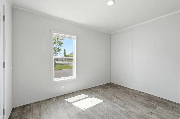 Unfurnished room featuring light wood-style floors, ornamental molding, and recessed lighting