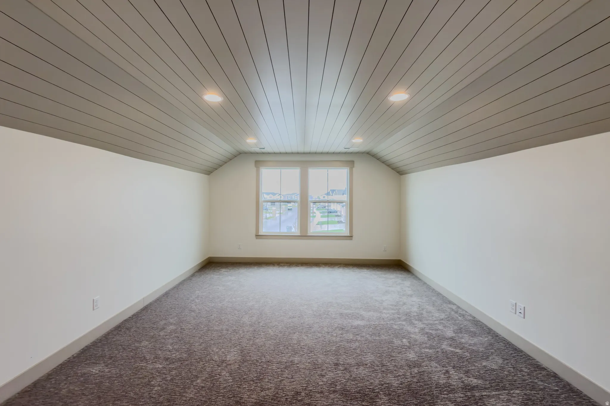 Bonus room with wooden ceiling, carpet flooring, and recessed lighting