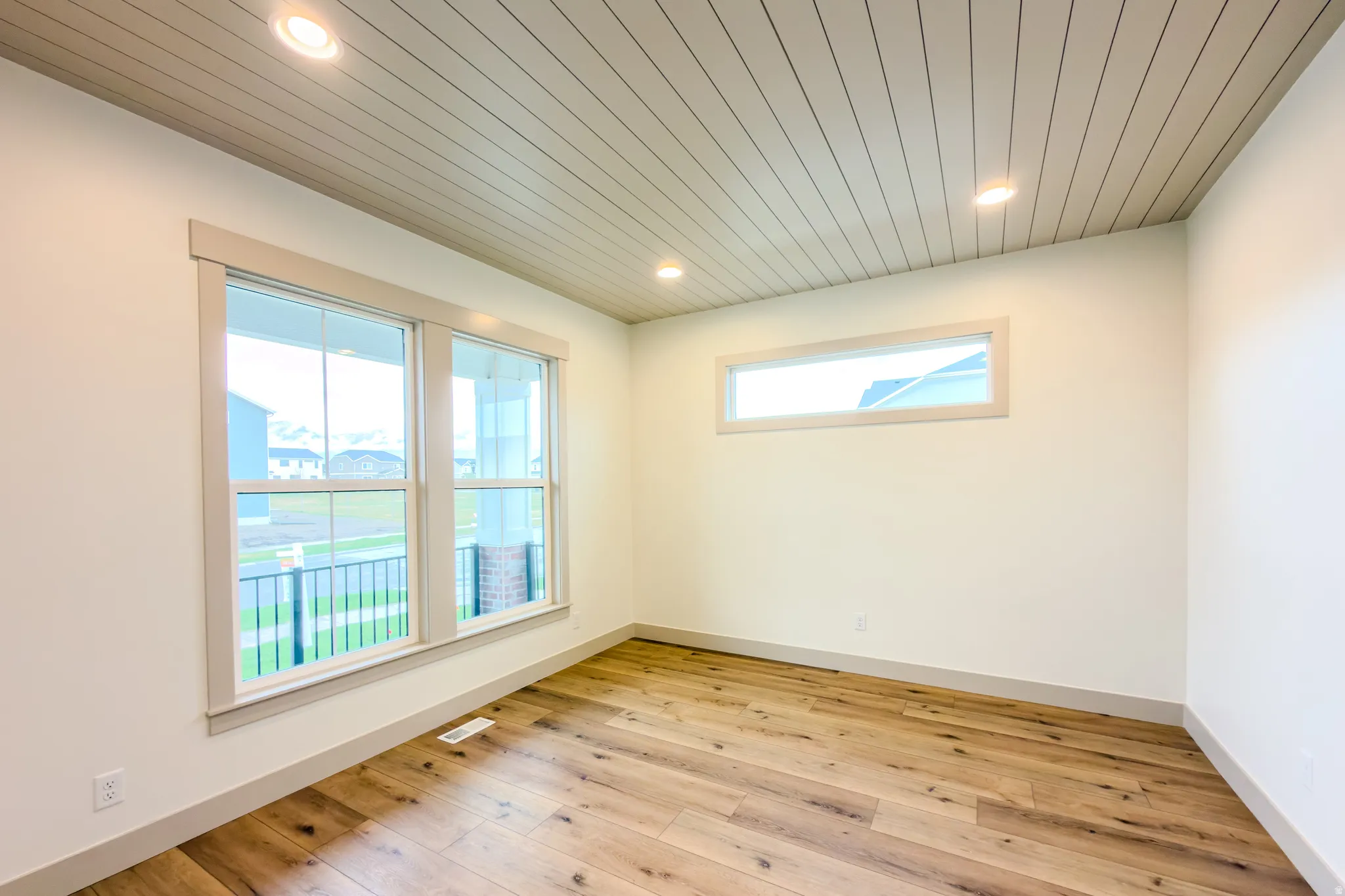 Spare room featuring wood ceiling, light wood-type flooring, and recessed lighting