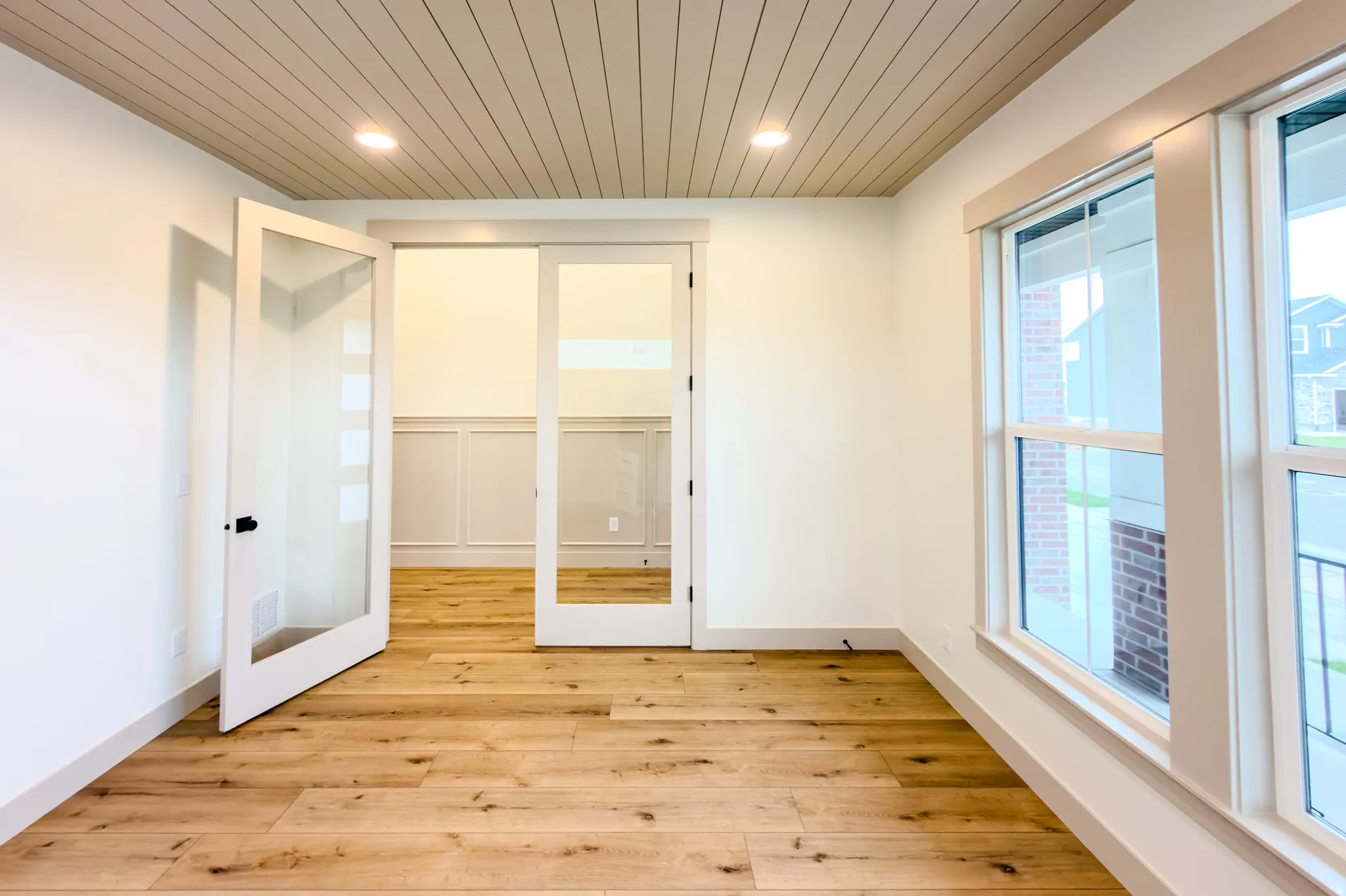 Unfurnished bedroom with wooden ceiling, light wood finished floors, and recessed lighting