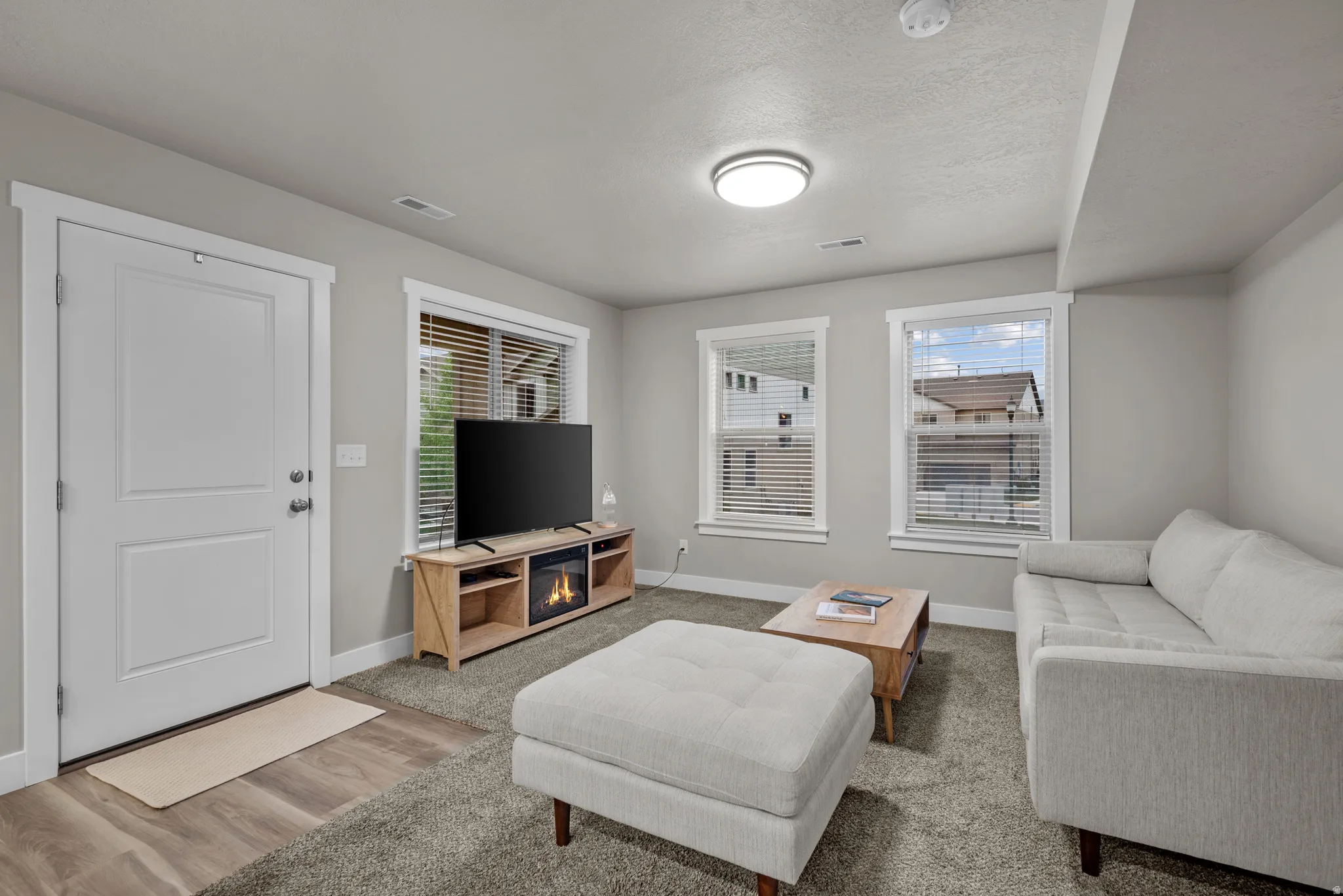 Living room featuring baseboards and wood finished floors