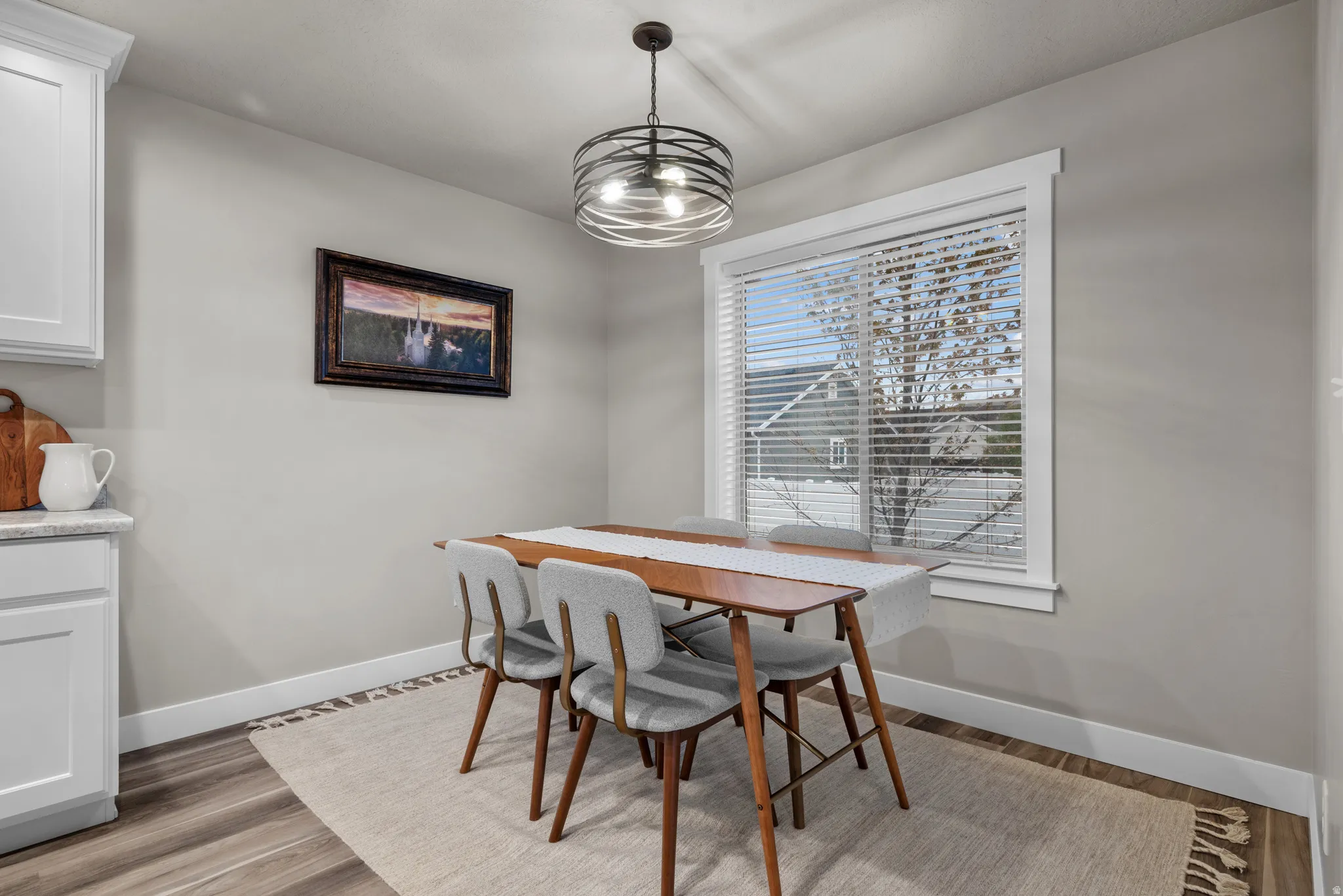 Dining space featuring baseboards and light wood-type flooring