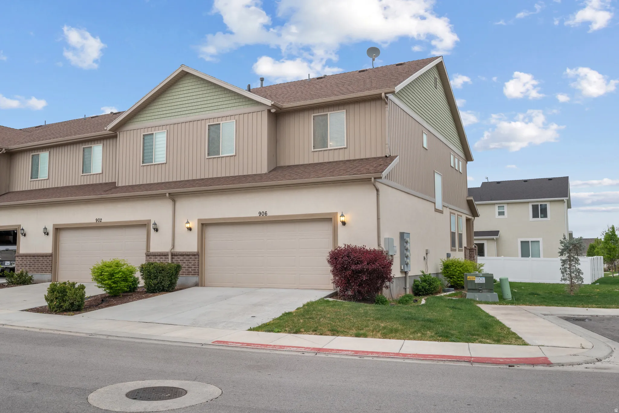 Traditional-style home featuring concrete driveway, an attached garage, and brick siding