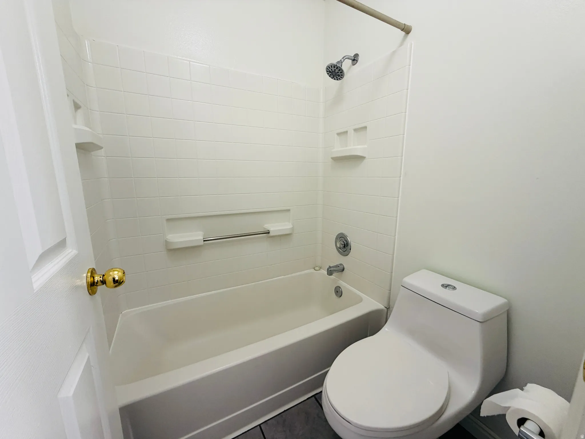 Full bath with toilet and shower / bath combination