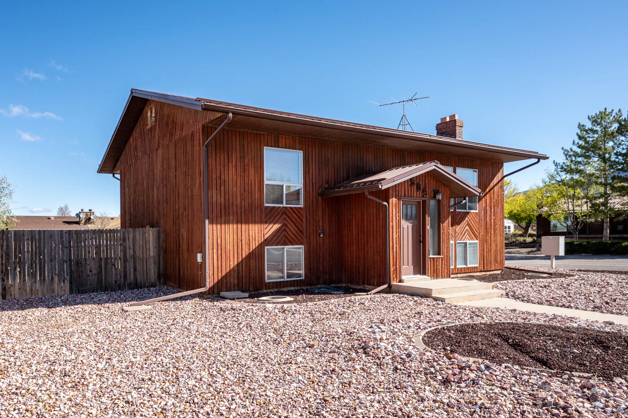 Rear view of property featuring a chimney