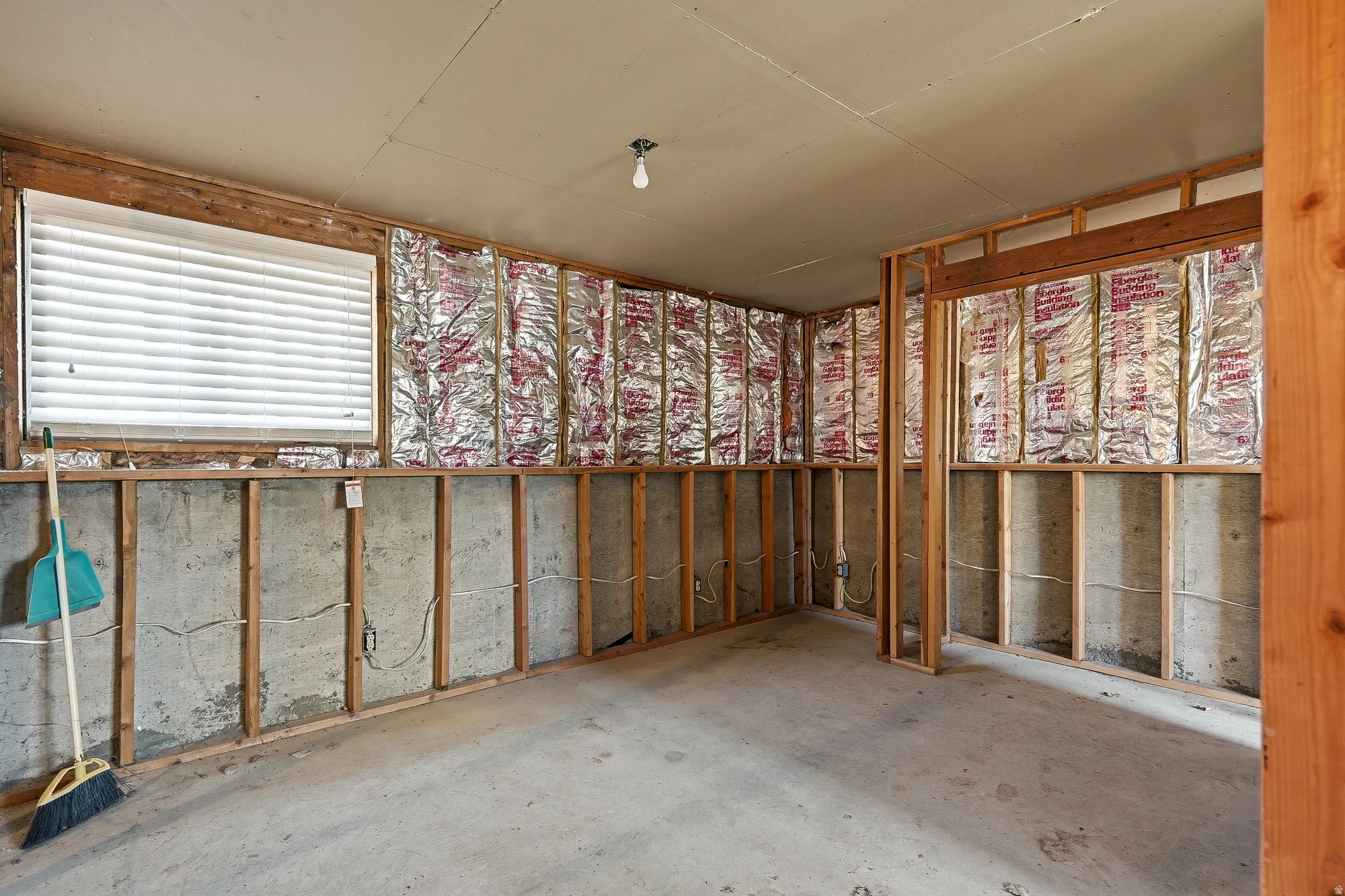 Miscellaneous room with concrete floors