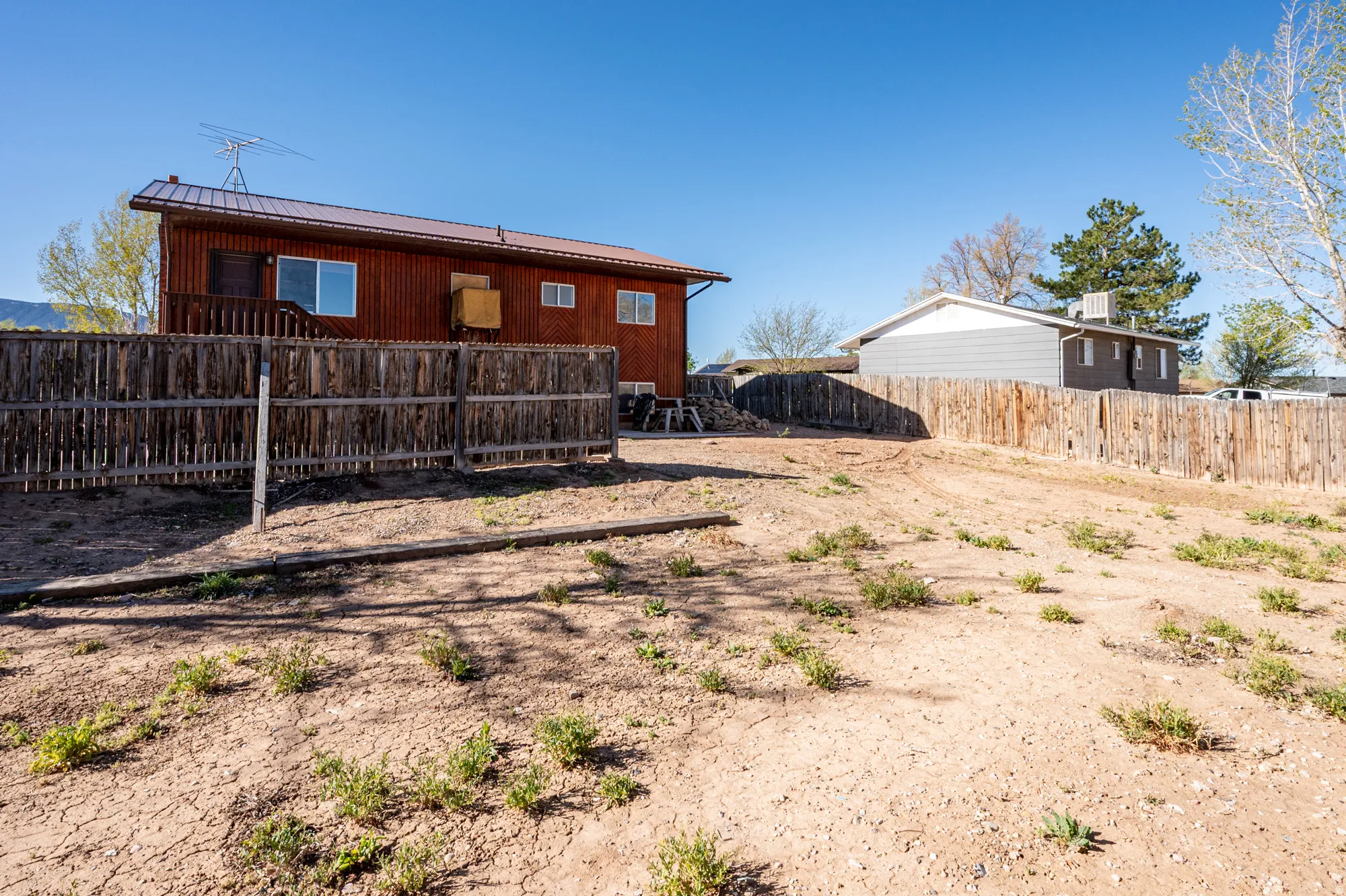 Rear view of property with a metal roof