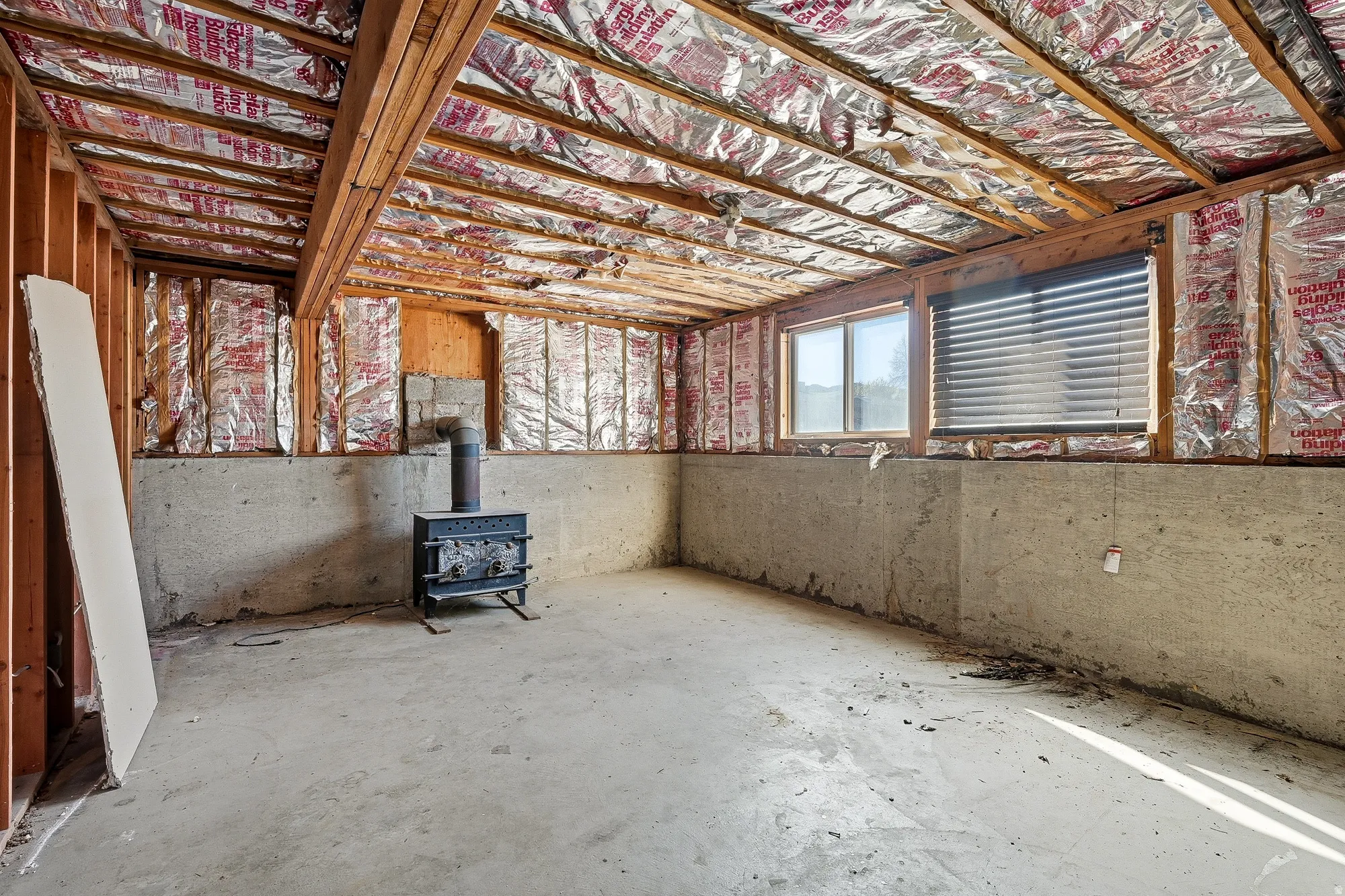 Basement featuring a wood stove