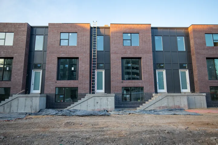 View of front of house featuring brick siding