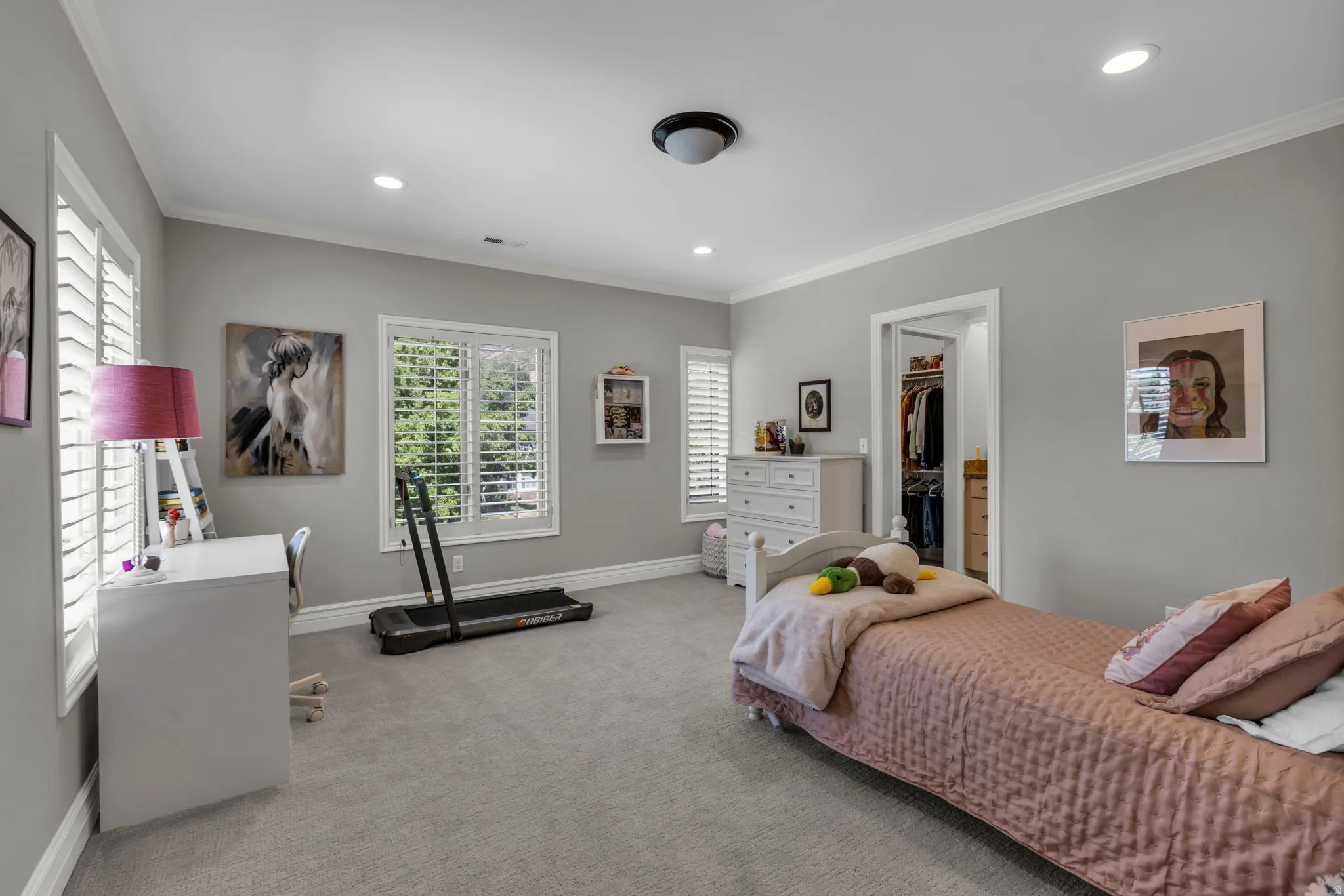 Spacious bedroom with a walk-in closet and private ensuite bathroom