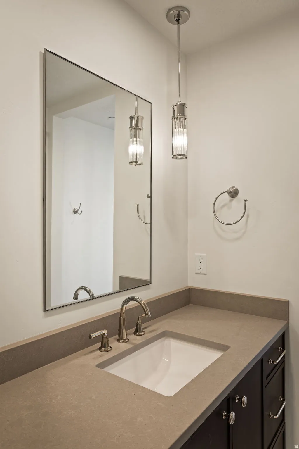 Photos of an exterior unit with the same finishes -Bathroom featuring vanity