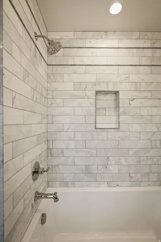 Photos of an exterior unit with the same finishes -Bathroom with bathing tub / shower combination