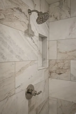 Photos of an exterior unit with the same finishes -Bathroom view of tiled shower