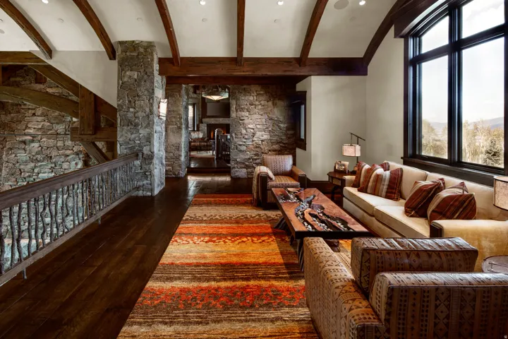 Living room featuring dark wood-type flooring and beamed ceiling