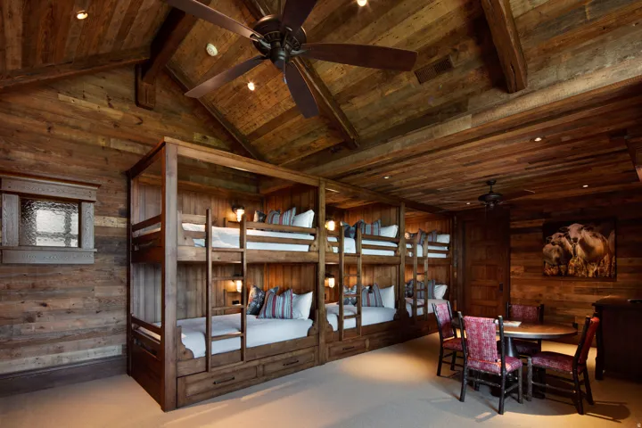 Carpeted bedroom with recessed lighting and a high wood beamed ceiling