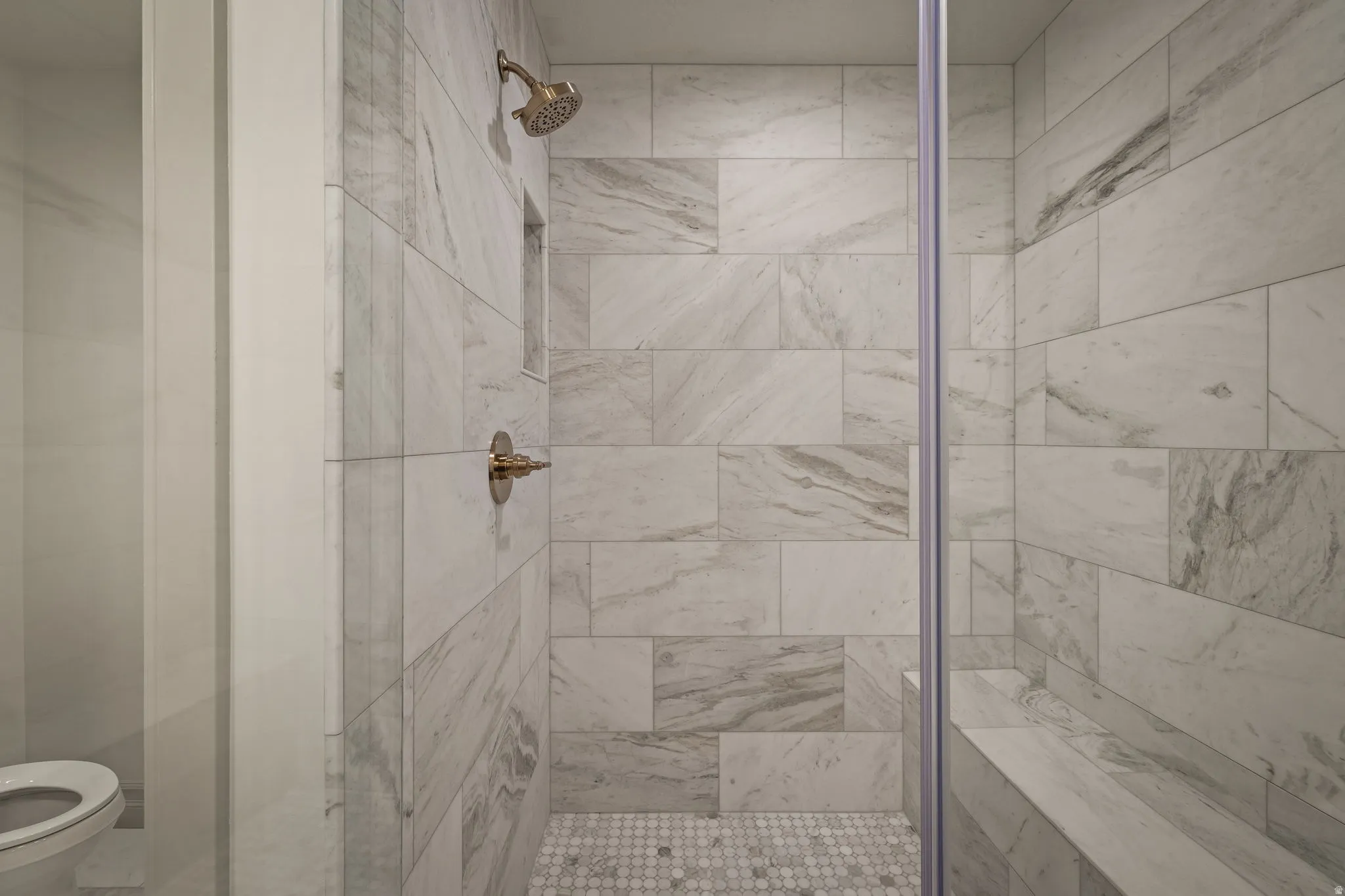 Full bathroom featuring a shower stall